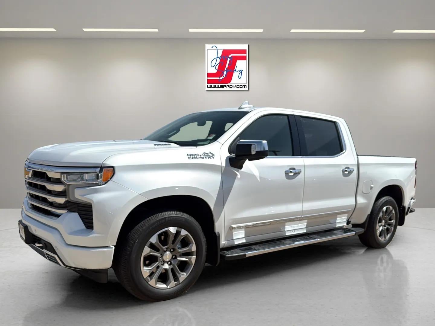 2023 Chevrolet Silverado 1500 High Country in Iridescent Pearl Tricoat — front three-quarter view