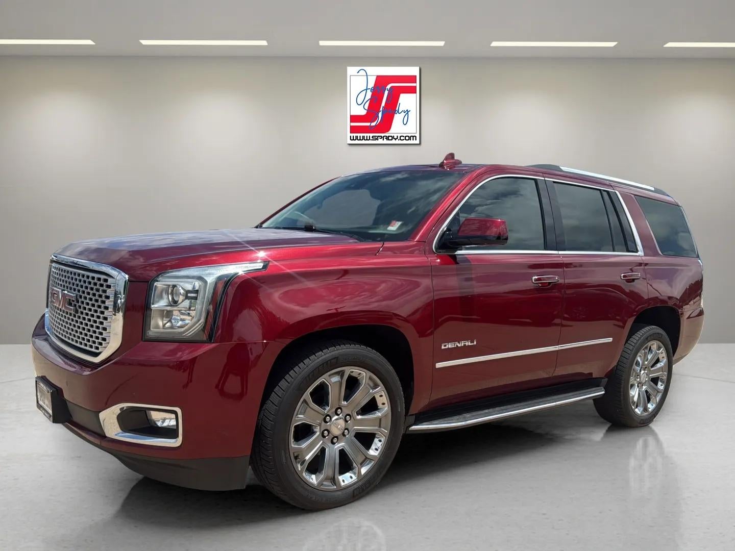 2016 GMC Yukon Denali in Crimson Red Tintcoat — front three-quarter view