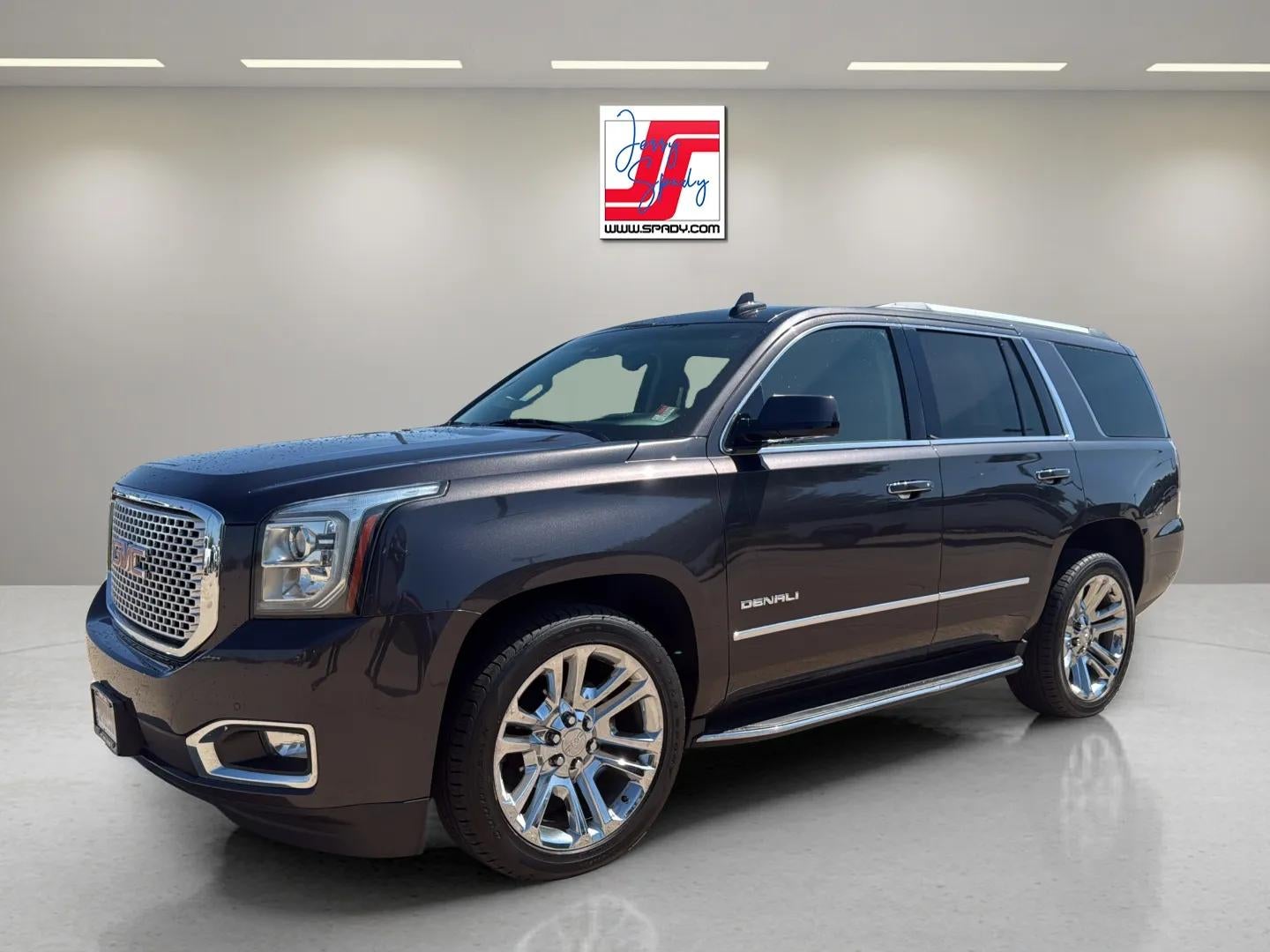 2016 GMC Yukon Denali in Iridium Metallic — front three-quarter view