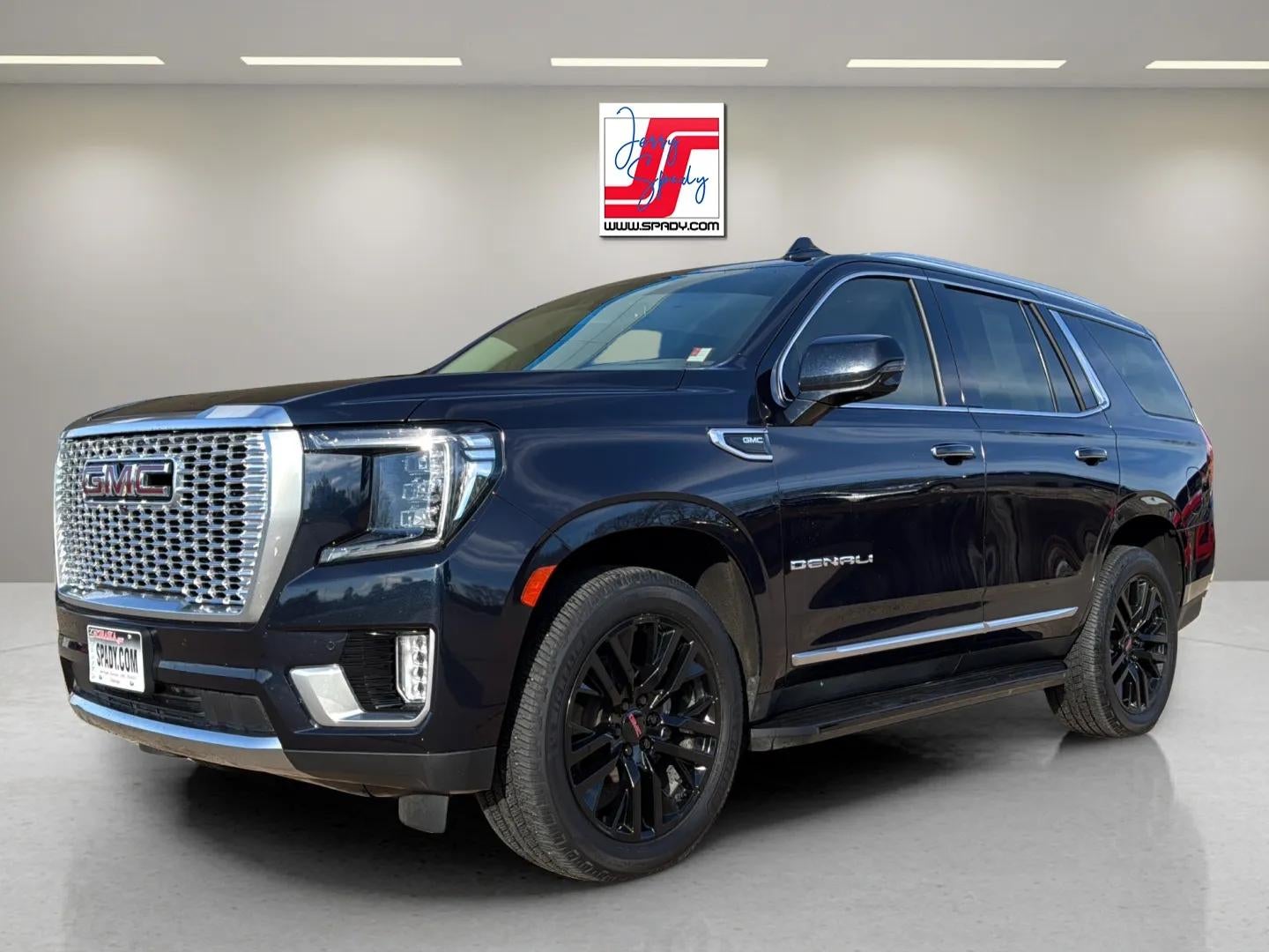 2022 GMC Yukon Denali in Midnight Blue Metallic — front three-quarter view