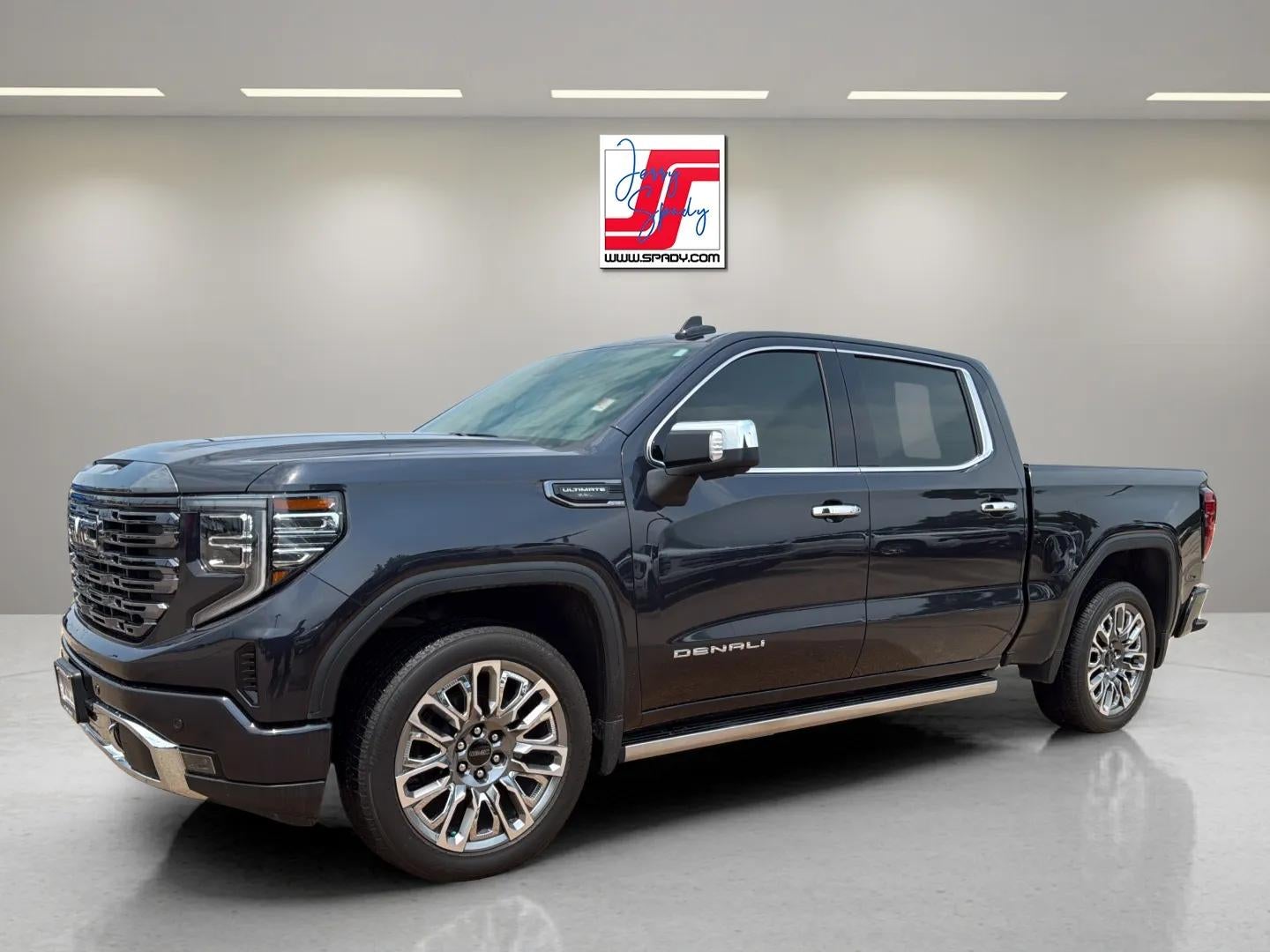 2023 GMC Sierra 1500 Denali Ultimate in Titanium Rush Metallic — front three-quarter view