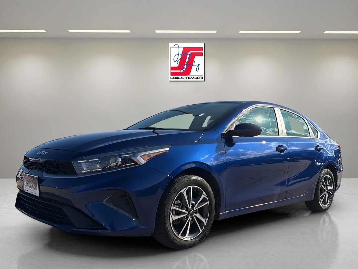2024 Kia Forte LXS in Blue — front three-quarter view